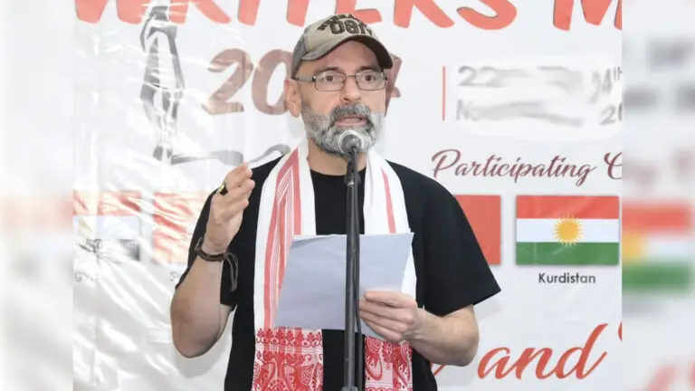 Man reading before a microphone